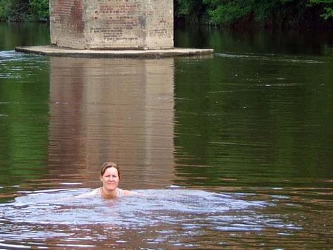 A woman swimming in River Wye at Bredwardine.
